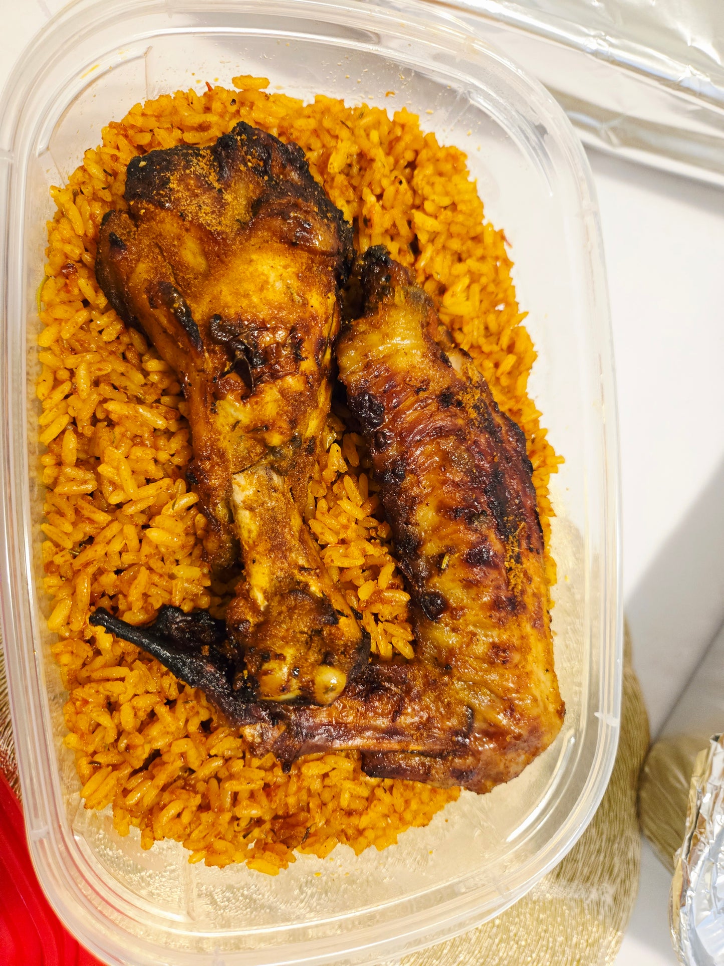 1 liter bowl jollof rice with 2 grilled turkey