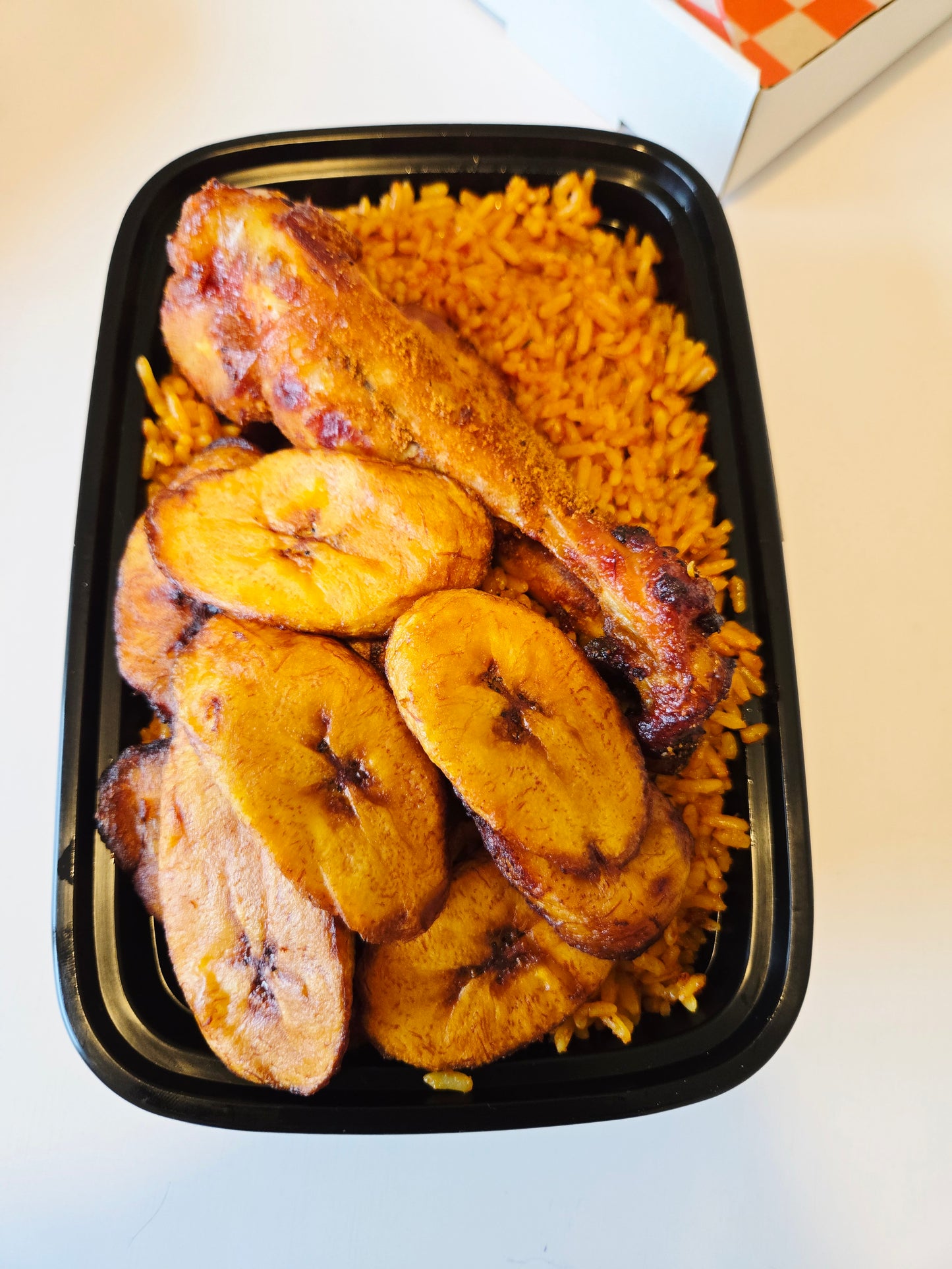 Single Serve Jollof rice, 1 grilled turkey and plaintain