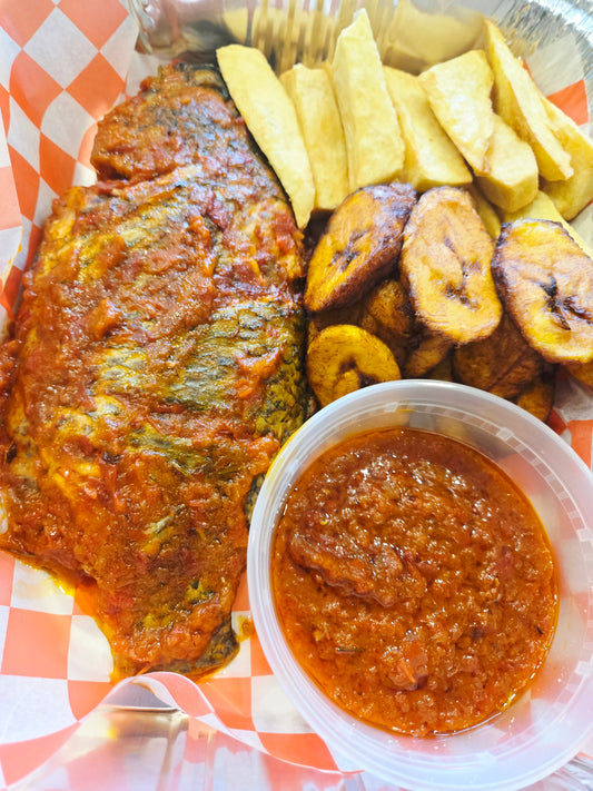 Grilled Tilapia fish with fried yam ,plantain  and sauce